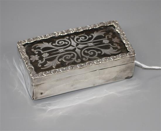 A silver and tortoiseshell trinket box containing dress studs